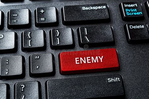 Enemy Word On The Red Enter Key Of A Desktop Pc Keyboard Laptop