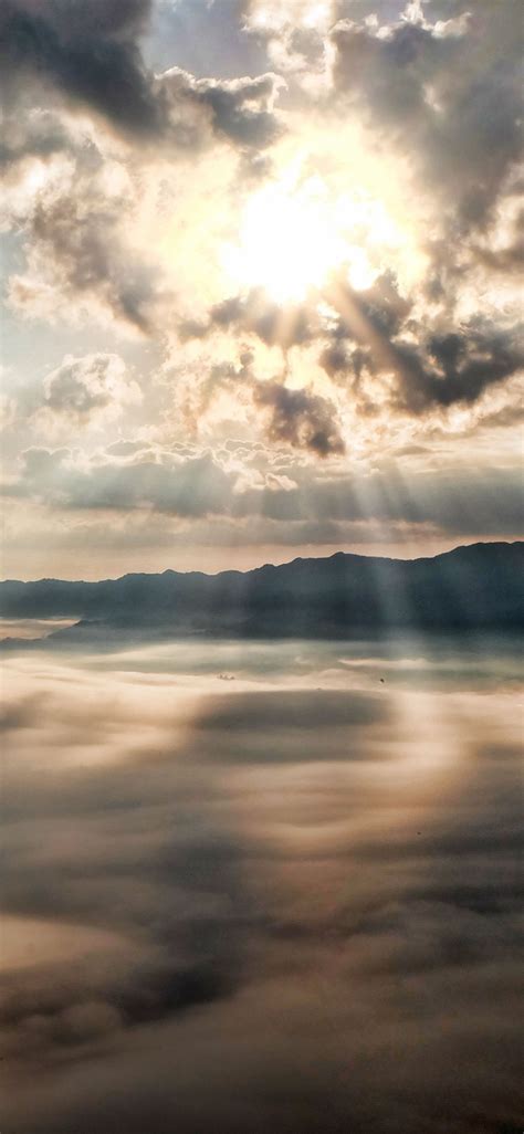 1125x2436 Sun Rays Through Clouds Mountains Iphone Xsiphone 10iphone
