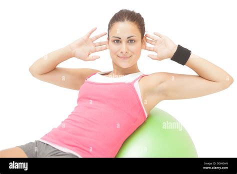 Content Sporty Brunette Doing Sit Ups On Exercise Ball Stock Photo Alamy