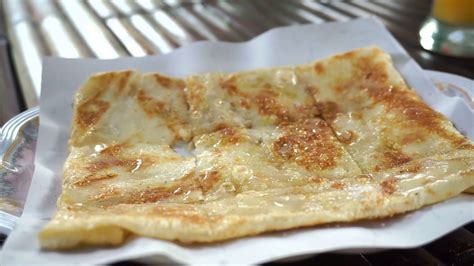 Close Up Shot Of Thai Popular Street Food Sweet Crispy Pancake Roti Serving In Plate Stock