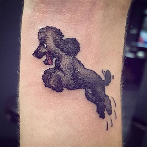 A Small Black Poodle Tattoo On The Ankle