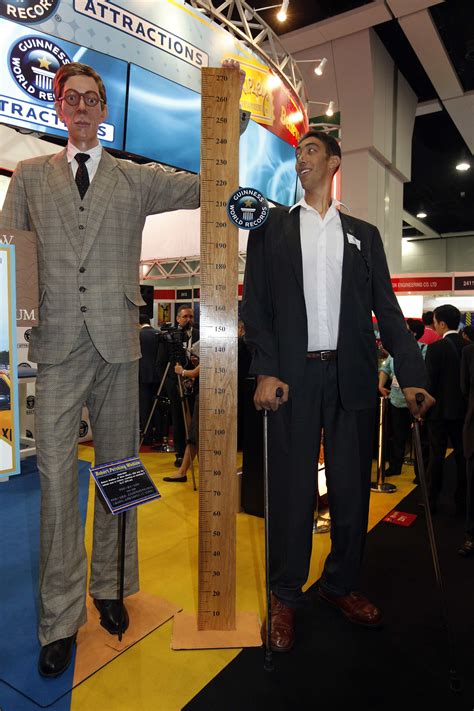Two Tallest Men In The World Standing Next To A 6 0 Tall Guy Tall