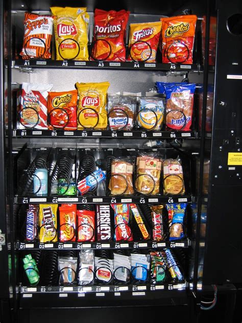 A Vending Machine Filled With Lots Of Snacks