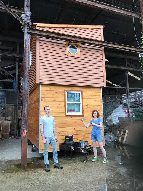 This Tiny House On Wheels Has A Raising Roof That Reveals A Second Floor