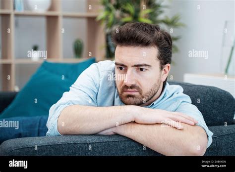 Sad Man Portrait At Home Feeling Depressed Stock Photo Alamy