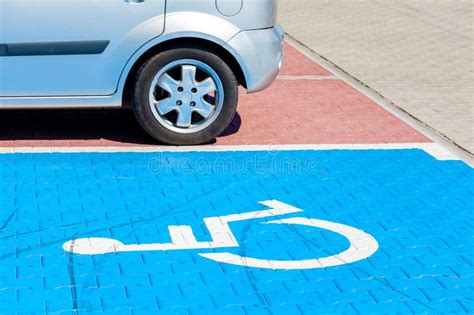 Blue Car Parking Spot For The Disabled Handicapped Wheelchair Symbol