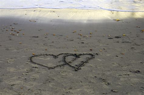 Two Hearts Drawn In Sand Free Stock Photo Public Domain Pictures