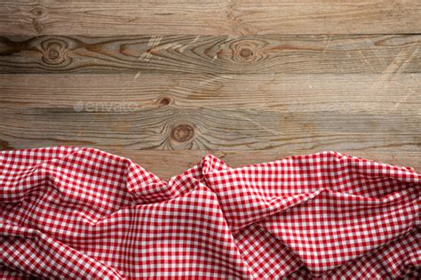 Maybe you would like to learn more about one of these? Red white checkered picnic tablecloth on wooden background ...