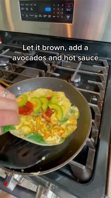 Someone Is Frying Some Food In A Pan On The Stove Top And Cooking It