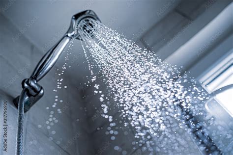 Water Running From Shower Head And Faucet In The Bathroom Stock Photo Adobe Stock