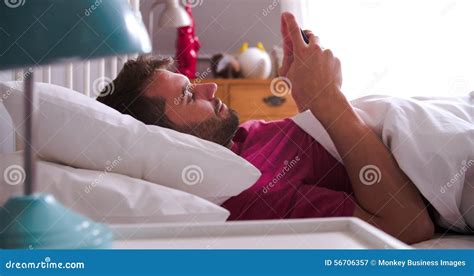 Man Waking Up In Bed And Checking Messages On Mobile Phone Stock Video Video Of Mobile Asleep