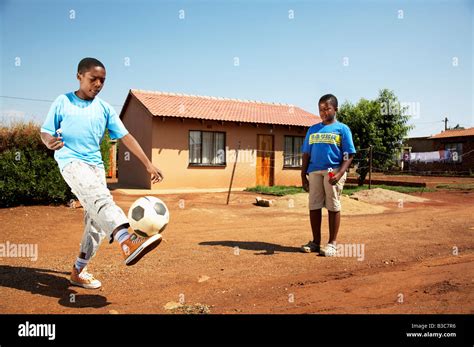 African Boys Playing Soccer Stock Photo Alamy