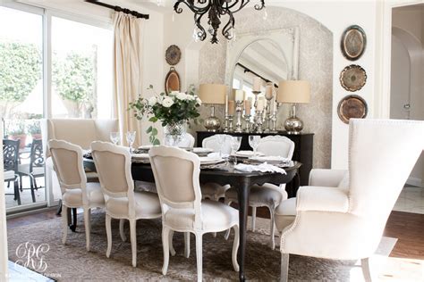 Contemporary chairs and wooden round table is the centerpiece of this dining room with a pendant light above it. Glam Transitional Dining Room Reveal - Randi Garrett Design