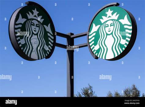 Starbucks Sign At Starbucks Coffee Shop Starbucks Is An American