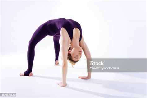 Nice Delighted Young Woman Bending Over Backwards Stock Photo
