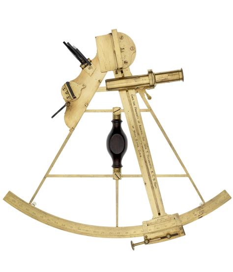 he sextant has a polished brass frame and a wooden handle the tangent screw which is bent is