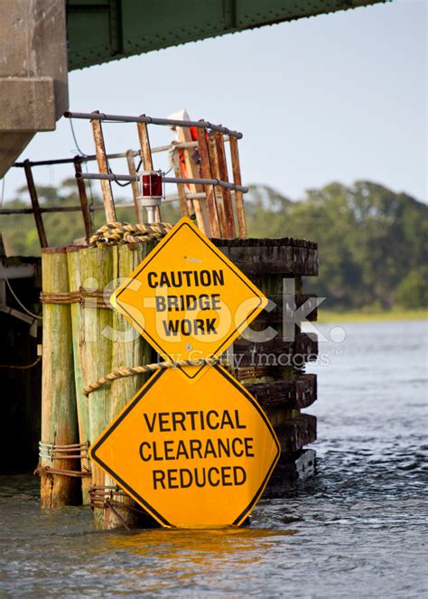 Bridge clearance is listed on marine charts, with the height above mean high water given. Caution Bridge Work Vertical Clearance Reduced Signs IN ...