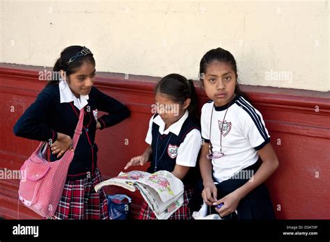 3 Young Mexican Schoolgirls On Street Dressed In School Uniforms With