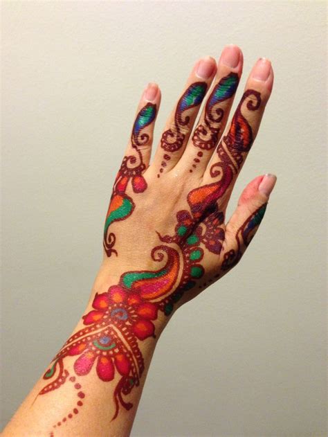 Some people visit countries and get indulged in these trends. Stunning Colorful Henna Design for Full Hands - Crayon