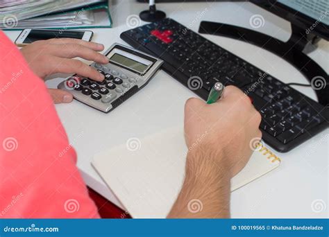 Hands Of Accountant Businessman With Calculator And Pen Stock Image