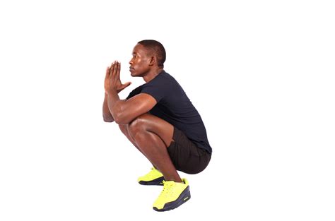 Fitness Man With Flexible Hips Doing Deep Squats