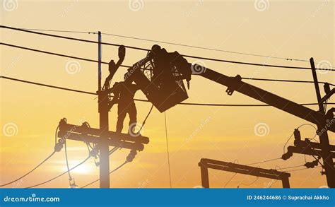 Silhouette Electricians Work On High Voltage Stock Photo Image Of