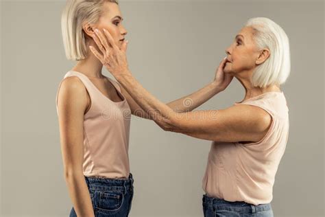 Nice Serious Women Touching Each Others Faces Stock Photo Image Of