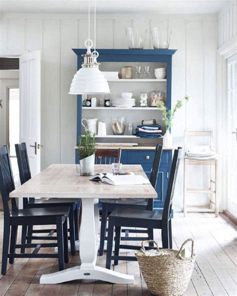Dining chairs don't just have to look good, but should feel good, too. Dark blue chairs with whitewashed table | Dining room blue, Country dining rooms, French country ...
