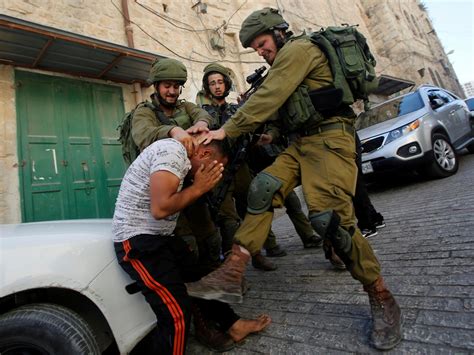 Israeli Soldiers Photographed Beating Palestinian In West Bank The Independent The Independent