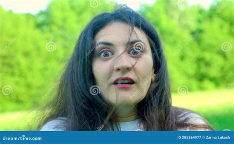 A Woman Is Frightened Looking At The Camera Her Eyes And Mouth Wide