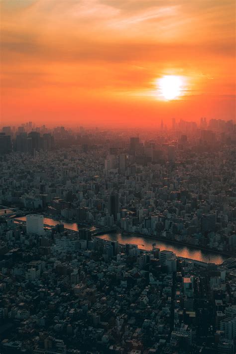 Download Breathtaking View of Japan's Cityscape at Sunset Wallpaper