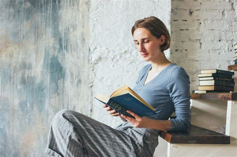 Young Woman Reading Book On Stairs Books To Read For Women Woman