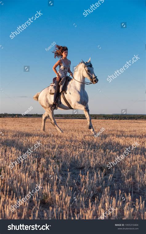 Young Woman Mounting Astride Stock Photo 1055310404 Shutterstock