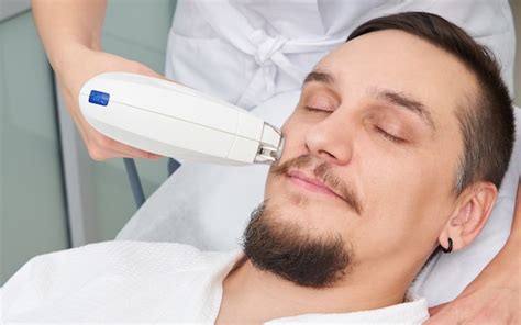 Premium Photo Man Having Laser Treatment At Beauty Clinic