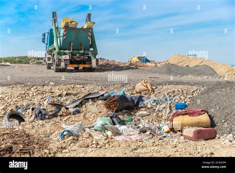 The Garbage Truck Brought The Waste To The Landfill Stock Photo Alamy