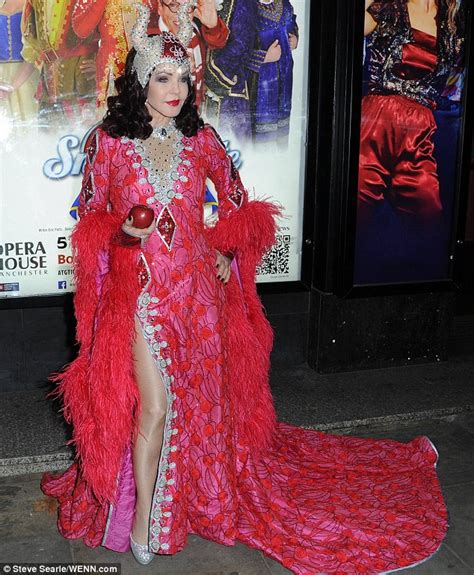 Priscilla Presley 69 Dons Beaded Red Dress With Thigh High Split At Snow White Photocall