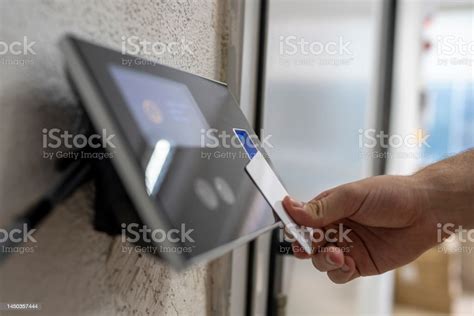 Male Hand Holding Key Card To Accessing The Room Stock Photo Download