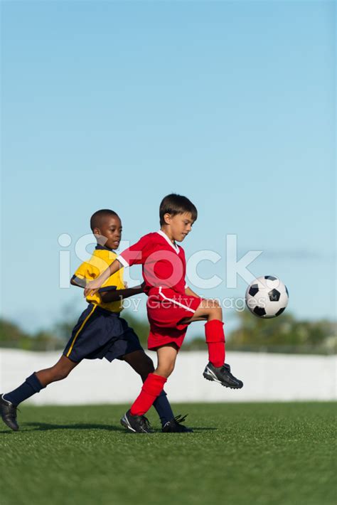 Two Young Boys Playing Football Stock Photo Royalty Free Freeimages