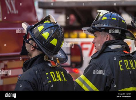Manhattan New York Firefighters On Duty Observe A Situation Stock