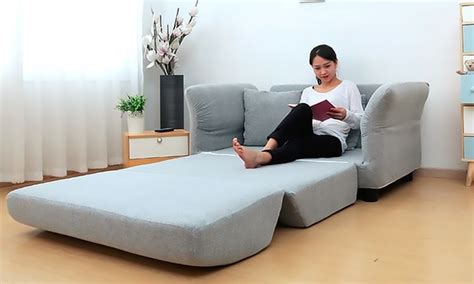 Serves as a chair and a bed. Convertible Grey Pull out Two Seater Sofa Bed