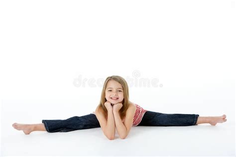 Young Girl In Gymnastic Pose Doing Splits Royalty Free Stock Images