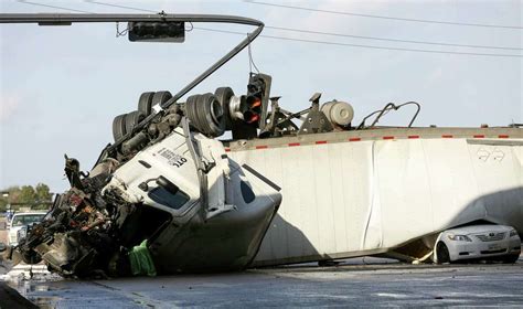 18 Wheeler Falls Off Overpass In Sugar Land Crushes Car Below