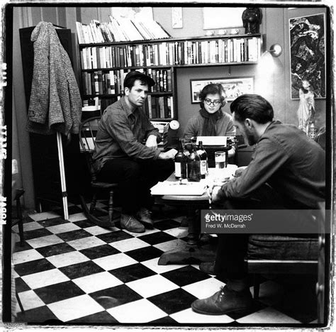 American Writers Jack Kerouac And Lew Welch Sit Around A Low Table As
