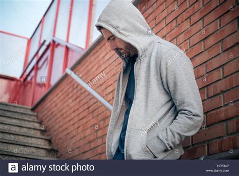 Lonely Man Leaning Against An Urban Wall Stock Photo Alamy