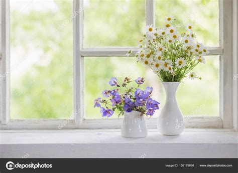Flowers In Vases On Windowsill Stock Photo By ©kruchenkova 159179698