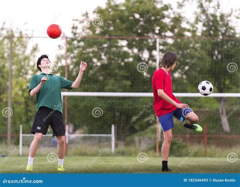 Teenagers Playing Football On Field Stock Image Image Of Playing