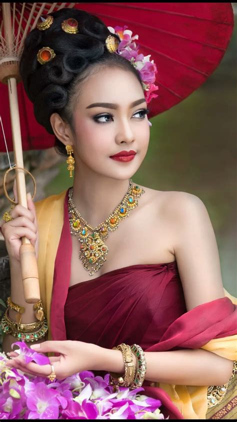 beautiful thai girl in thai traditional costume she smile and looking high beautiful thai