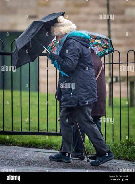 Two Women Battle Through Heavy Rain In Yeadon West Yorkshire As Gales