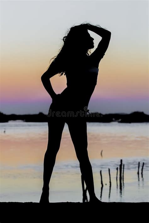 Hispanic Brunette Model Enjoying An Early Morning Sunrise Stock Image