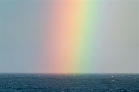Rainbow On Sky Over Sea · Free Stock Photo